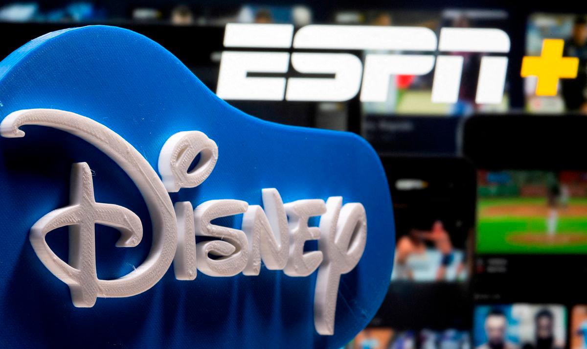 FILE PHOTO: A 3D printed Disney logo is seen in front of the ESPN+ logo in this illustration created on July 13, 2021. REUTERS/Dado Ruvic/Illustration/File Photo