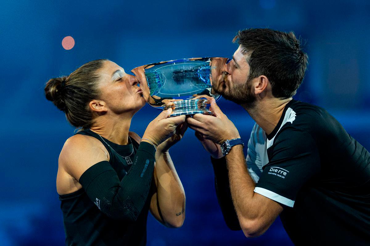 Sara Errani of Italy and Andrea Vavassori of Italy pose with the winner’s trophy after their victory over Casper Ruud of Norway and Ina Swiatek of Poland who pose with the runner up’s trophy after the final of the mixed doubles tournament at the US Open at Arthur Ashe Stadium. : Mike Frey-Imagn Images - REUTERS
