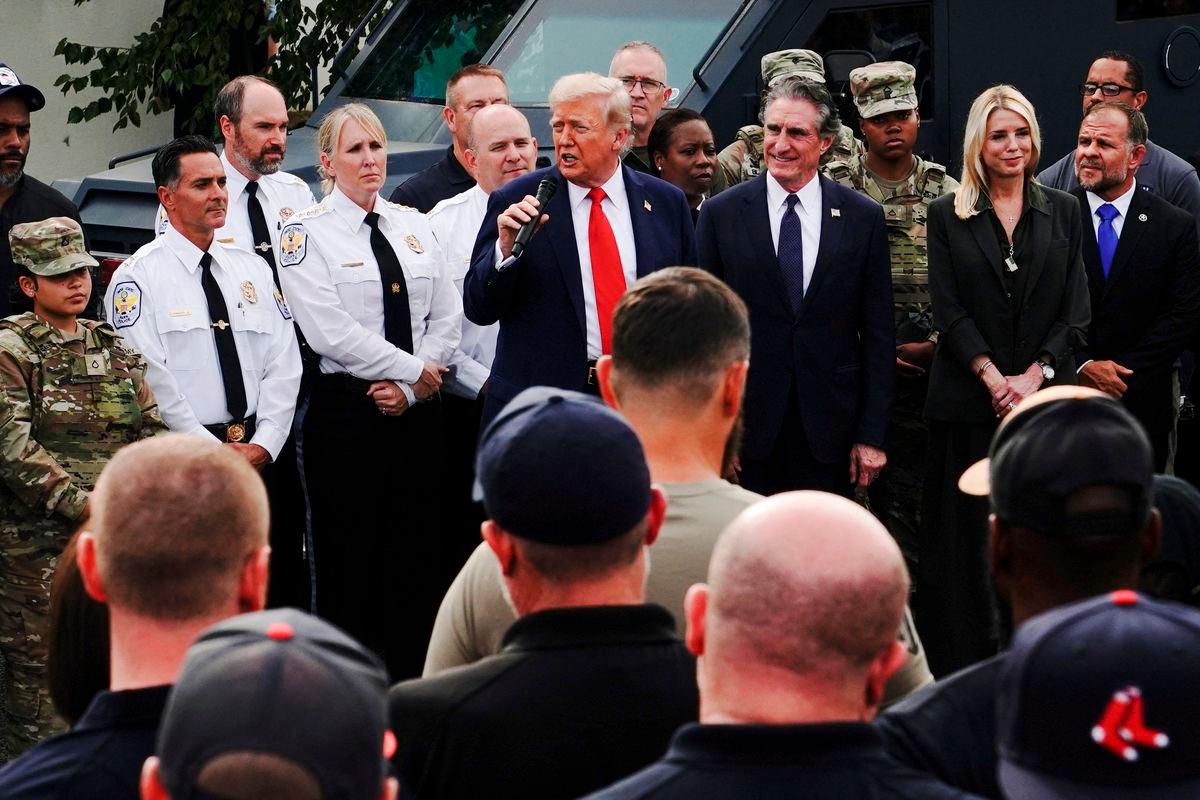 U.S. President Donald Trump speaks as U.S. Attorney General Pam Bondi and U.S. Interior Secretary Doug Burgum stand by his side, while he attends U.S. Park Police Anacostia Operations Facility to meet with police and the military, after deploying National Guard troops in the nation’s capital, in Washington, D.C., U.S., August 21, 2025. REUTERS/Nathan Howard