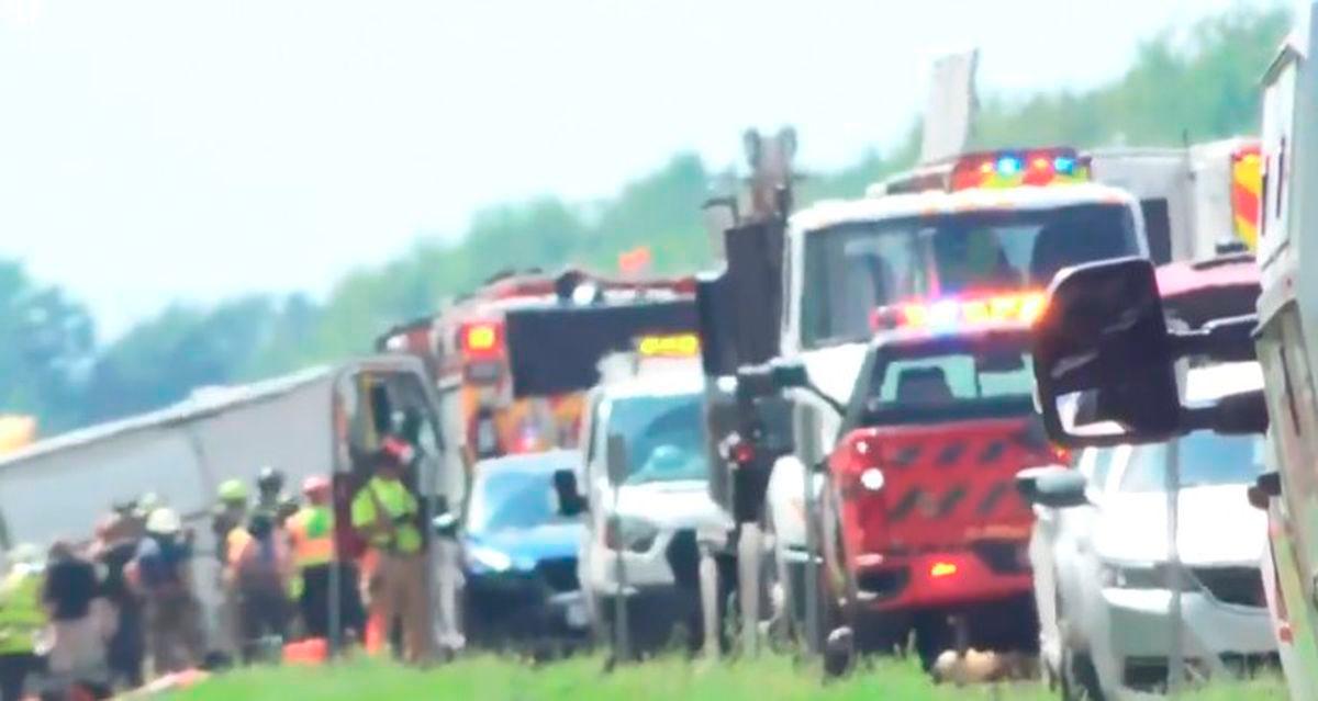 Images of rescuers at the site where a bus crashed on the Interstate 90 highway in New York state. - AFP