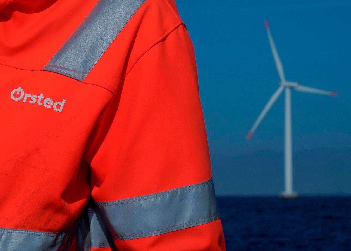 FILE PHOTO: The logo for Orsted can be seen on the jacket worn by an employee as he talks to journalists during a visit to the offshore wind farm near Nysted, Denmark, September 4, 2023. REUTERS/Tom Little/File Photo/File Photo