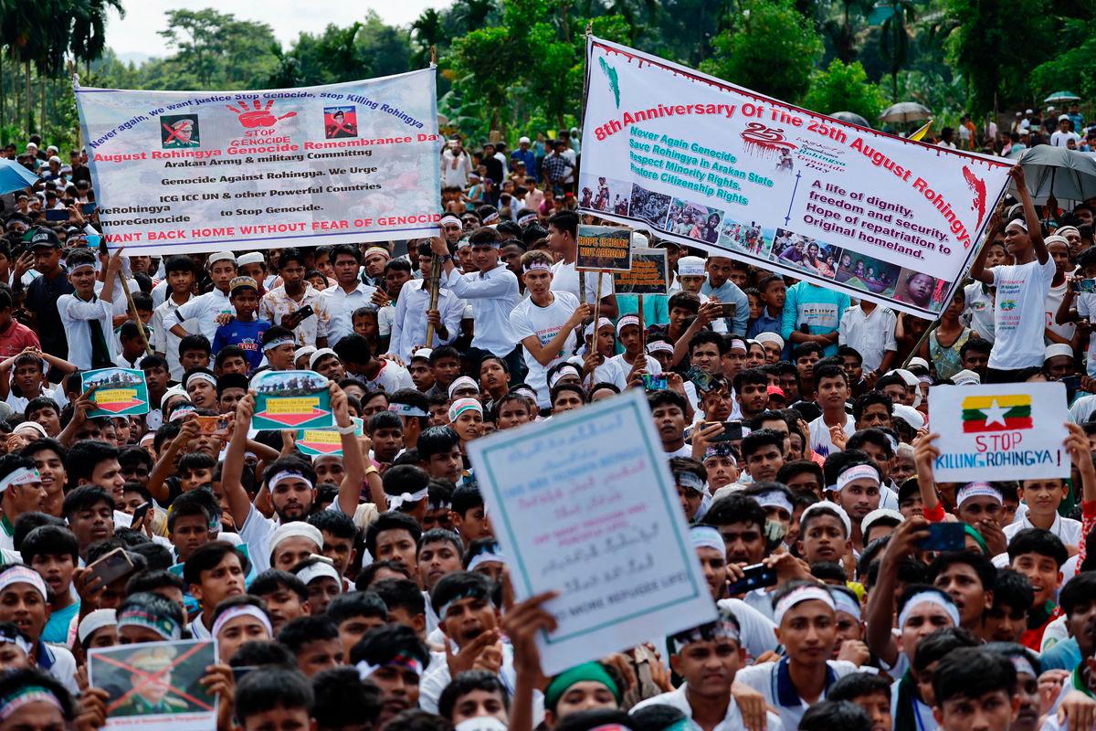 Rohingya refugees hold banners and placards while taking part in a protest rally inside a refugee camp to mark the eight-year anniversary of their exodus, in Cox’s Bazar, Bangladesh, August 25, 2025. REUTERS/Mohammad Ponir Hossain