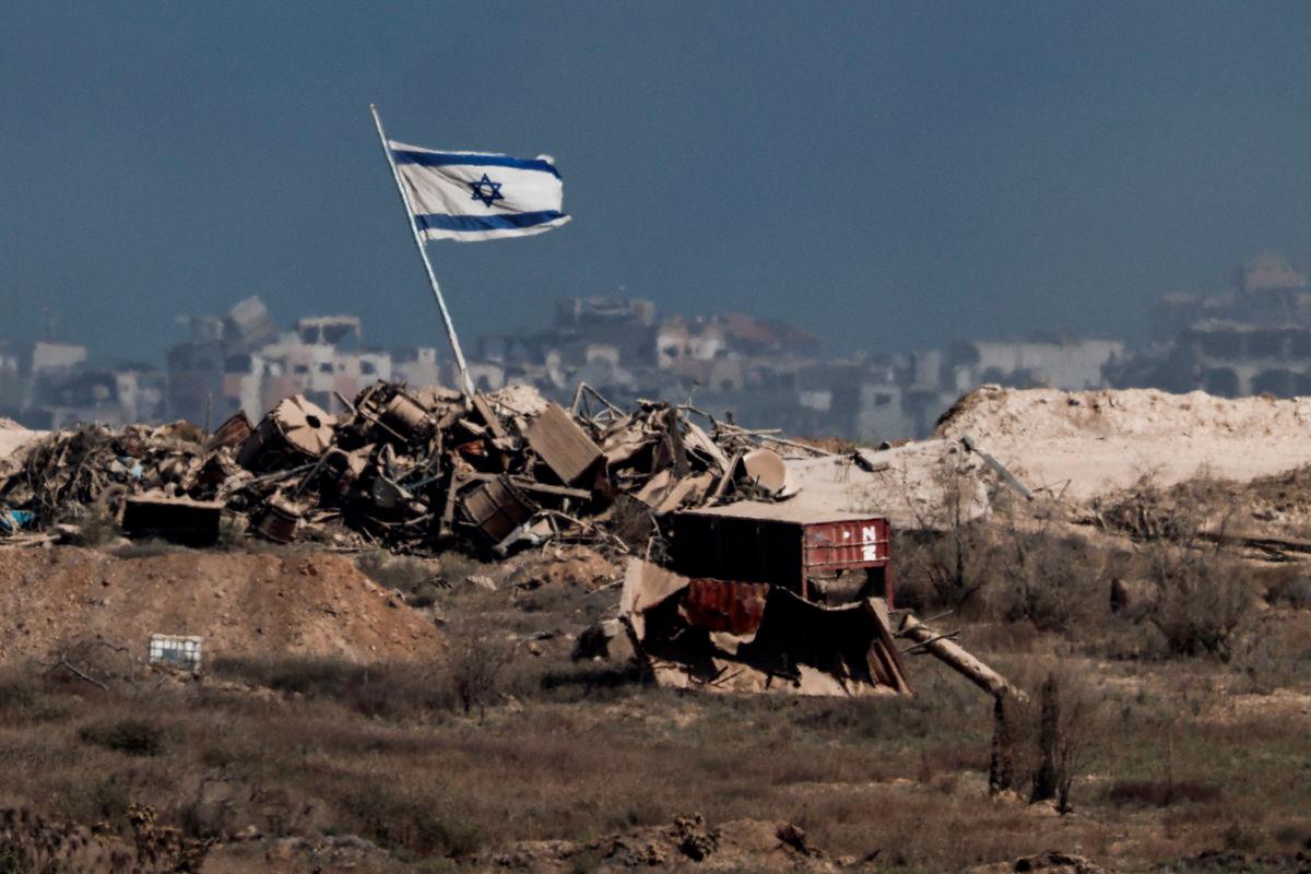 An Israeli flag flutters in Gaza, as seen from the Israeli side of the border with Gaza, August 26, 2025. - REUTERSPIX