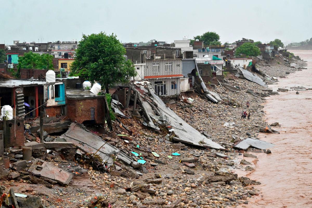 Debris of damaged residential houses lies along the banks of Tawi River following heavy rainfall in Jammu, Indian Kashmir, August 27, 2025. REUTERS/Mukesh Gupta