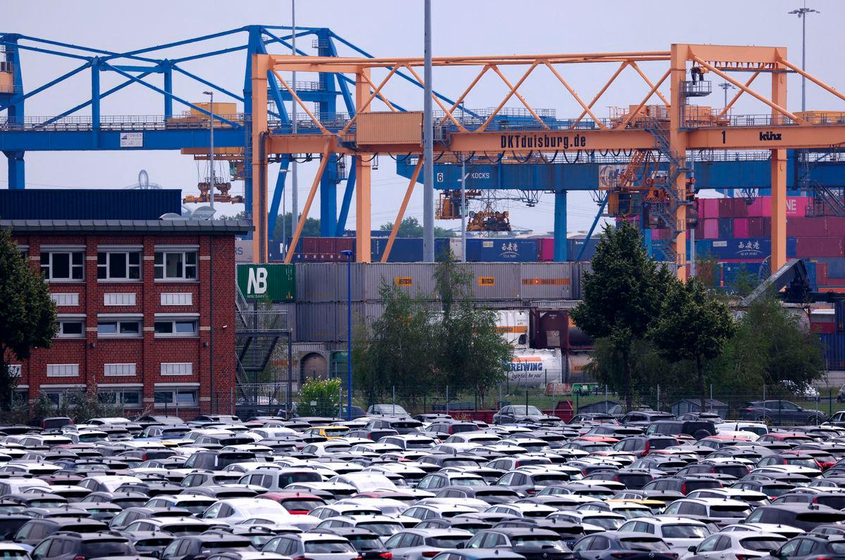 FILE PHOTO: Brand-new cars are stored at a car terminal, after U.S. President Donald Trump threatened on Saturday to impose a 30% tariff on imports from Mexico and the European Union starting on August 1, in the harbour of Duisburg, Germany, July 14, 2025. REUTERS/Thilo Schmuelgen/File Photo