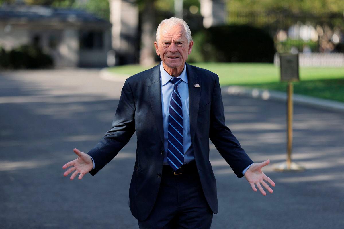 White House trade advisor Peter Navarro speaks to photographers on the West Wing driveway at the White House in Washington, D.C., U.S., August 28, 2025. REUTERS/Jonathan Ernst