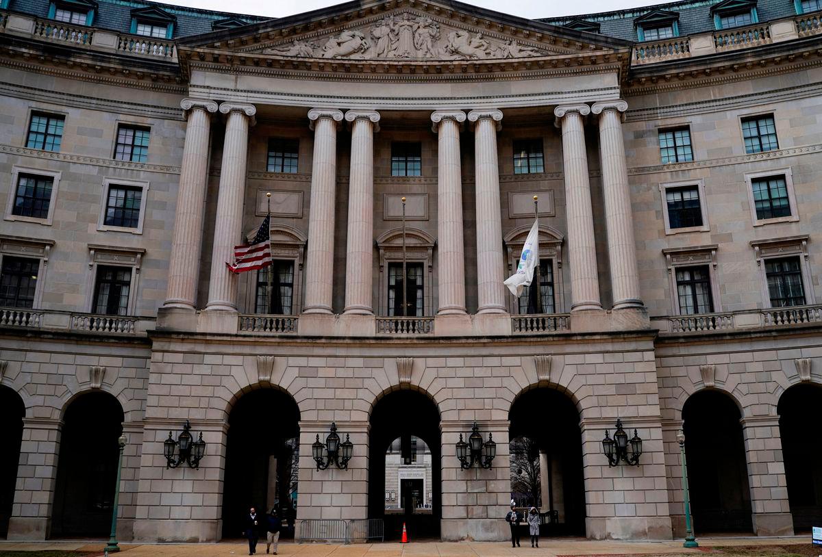 FILE PHOTO: People walk outside the headquarters of the United States Environmental Protection Agency (EPA) in Washington, D.C., U.S., February 18, 2025. REUTERS/Kent Nishimura/File Photo