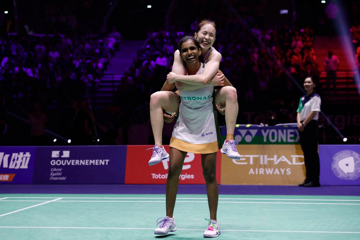 Malaysia's Pearly Tan and Thinaah Muralitharan at BWF World Championships, celebrating after winning their women's doubles semifinal match against Japan's Chiharu Shida and Nami Matsuyama. - REUTERS