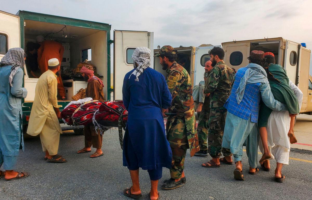 Taliban soldiers and civilians carry earthquake victims to an ambulance at an airport in Jalalabad, Afghanistan, September 1, 2025. REUTERS/Stringer