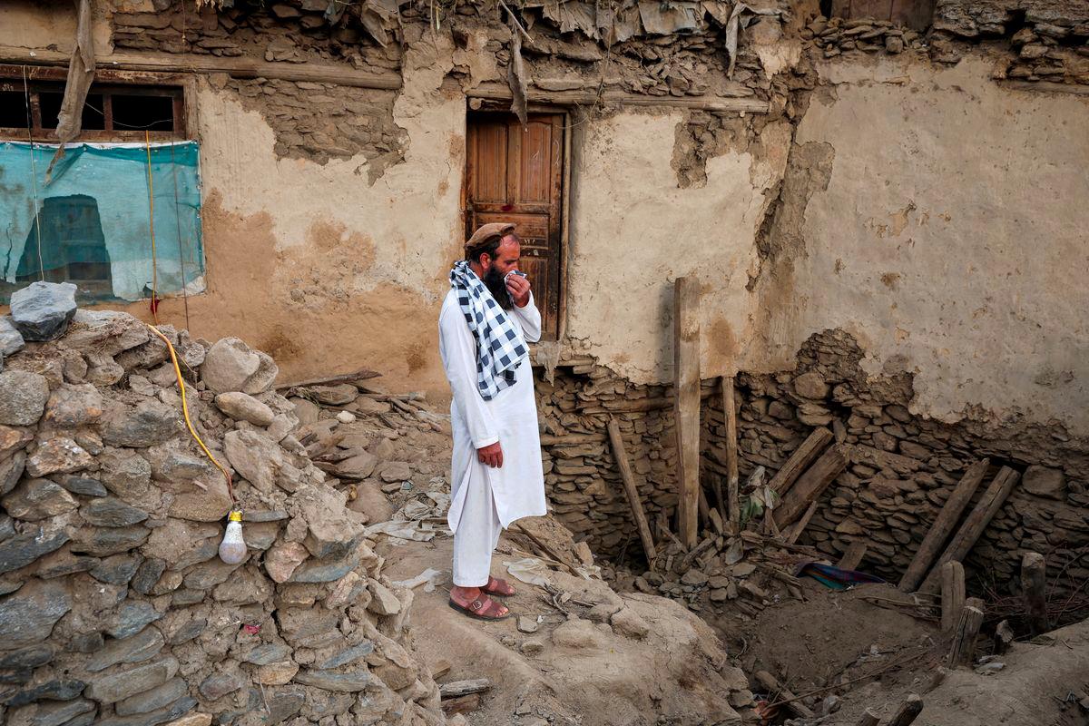 An Afghan man reacts as he stands amidst the rubble of a collapsed house after a deadly magnitude-6 earthquake that struck Afghanistan around midnight, in Dara Noor, in Jalalabad, Afghanistan, September 1, 2025. - REUTERSPIX