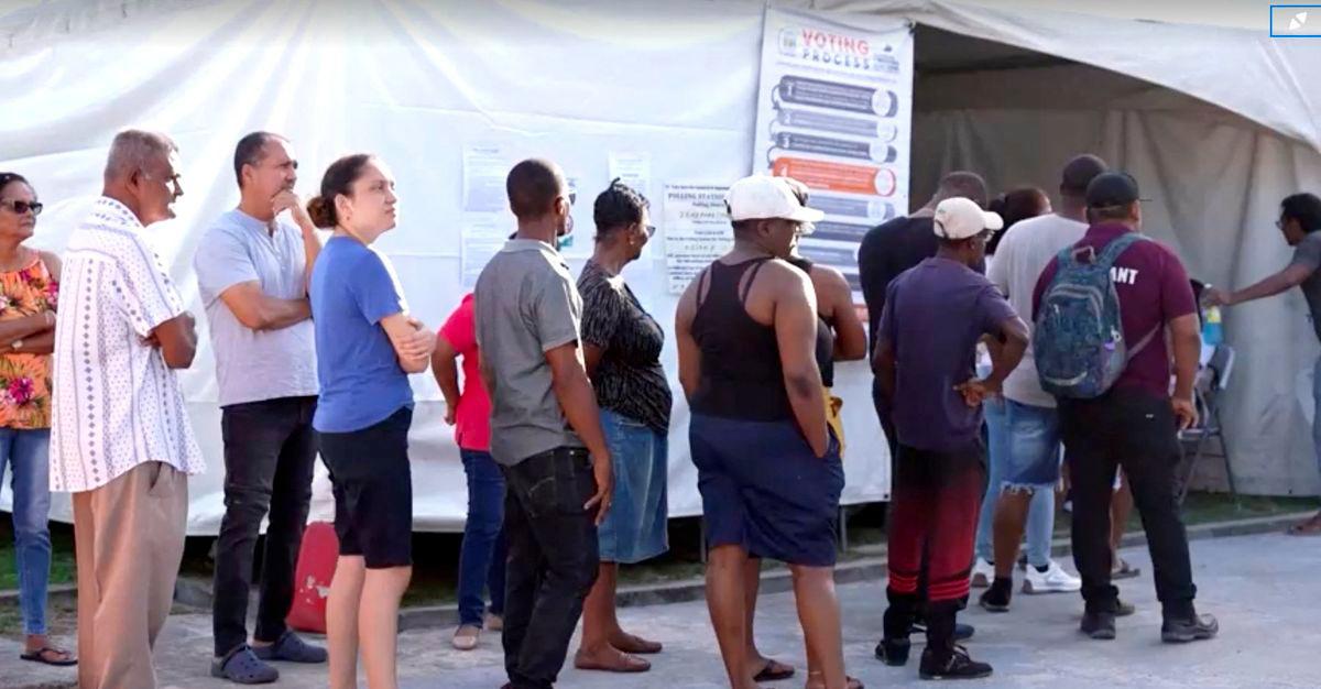 People wait to cast their vote during the general election in Georgetown, Guyana, September 1, 2025, in this screen grab taken from a video. - Reuters TV/via REUTERSPIX
