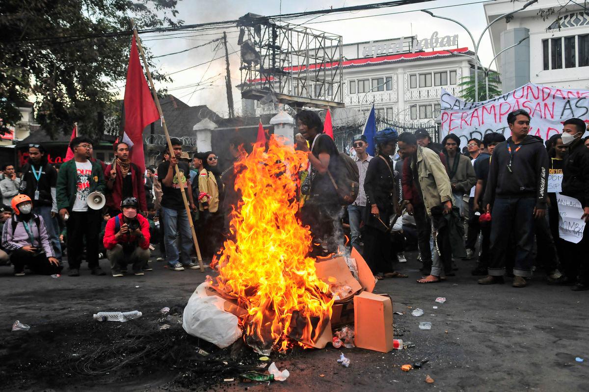 Protesters gather near items being burned outside the regional parliament building during a protest against the government's spending priorities, such as enhanced perks for lawmakers, in Bandung, West Java province, Indonesia, September 1, 2025. - REUTERSPIX