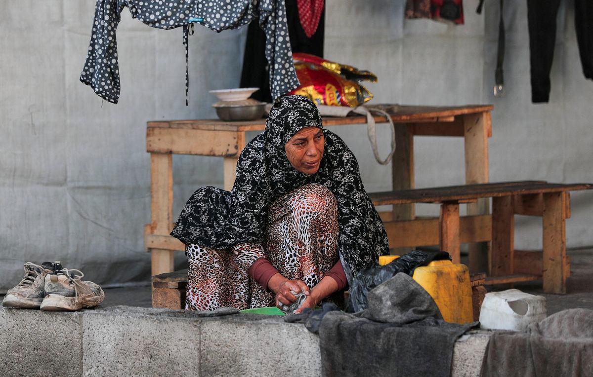 A Palestinian woman displaced by the Israeli military offensive takes shelter in a tent camp, as Israeli forces escalate operations around Gaza City, in Gaza City, September 2, 2025. - REUTERSPIX