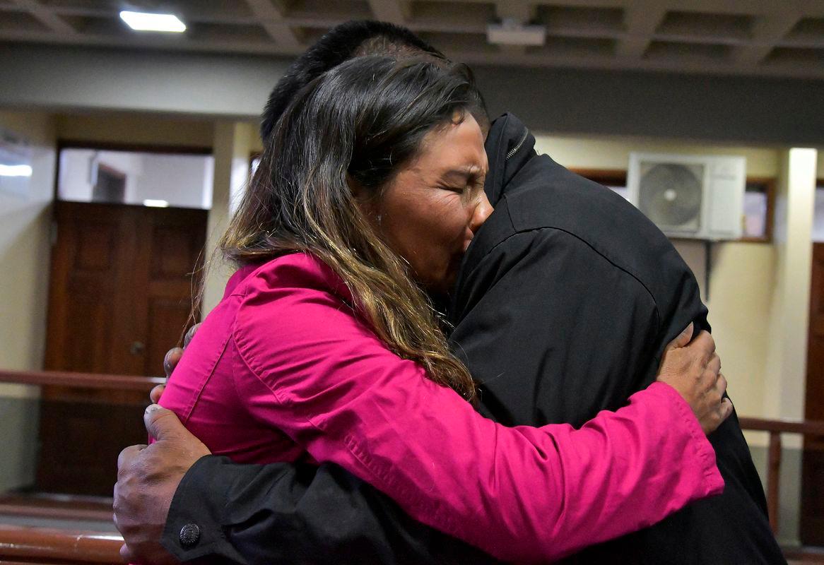 Erika Montano, sister of a Jesuit priest and child abuse victim who died by suicide, hugs a clergy abuse survivor, after a Bolivian court sentenced two elderly Spanish Jesuit priests to a year each in prison for concealing decades of abuse committed by fellow priest Alfonso Pedrajas, who died in 2009, in Cochabamba, Bolivia September 2, 2025. Reuterspix