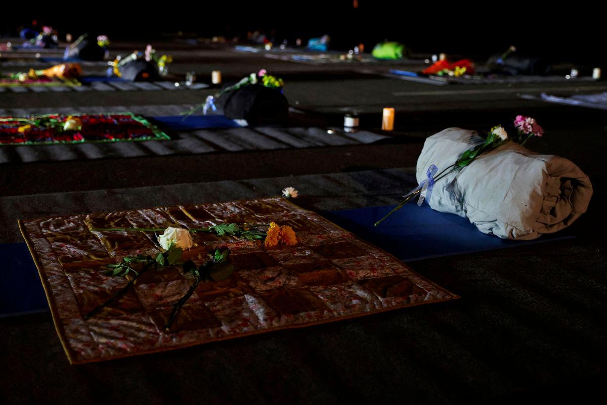 Flowers rest on the memorial for the 18 victims outside the Schemengees Bar &amp; Grille, on the one-year anniversary of the mass shooting in Lewiston, Maine, U.S. October 25, 2024. - REUTERSPIX