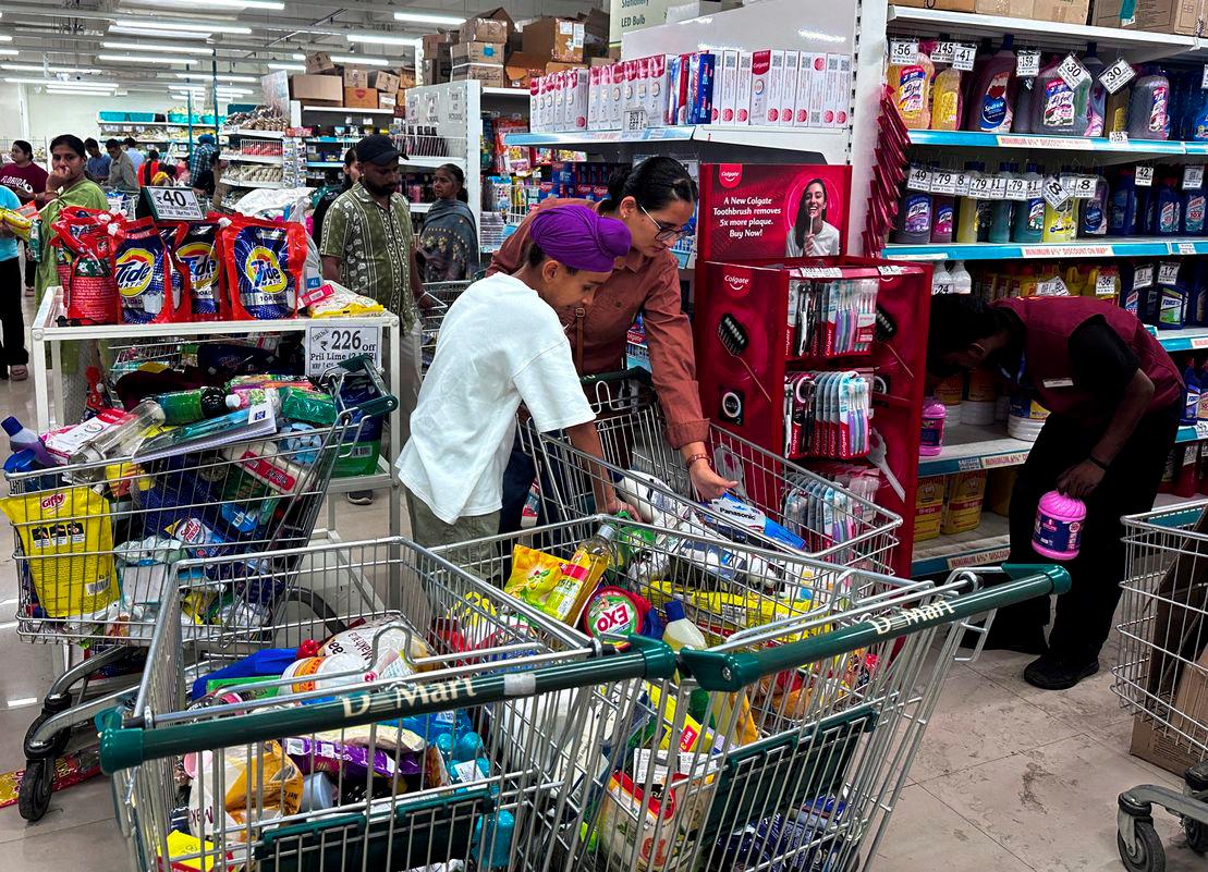 People shop for essential goods at a supermarket in Amritsar, India, May 9, 2025. - REUTERSPIX