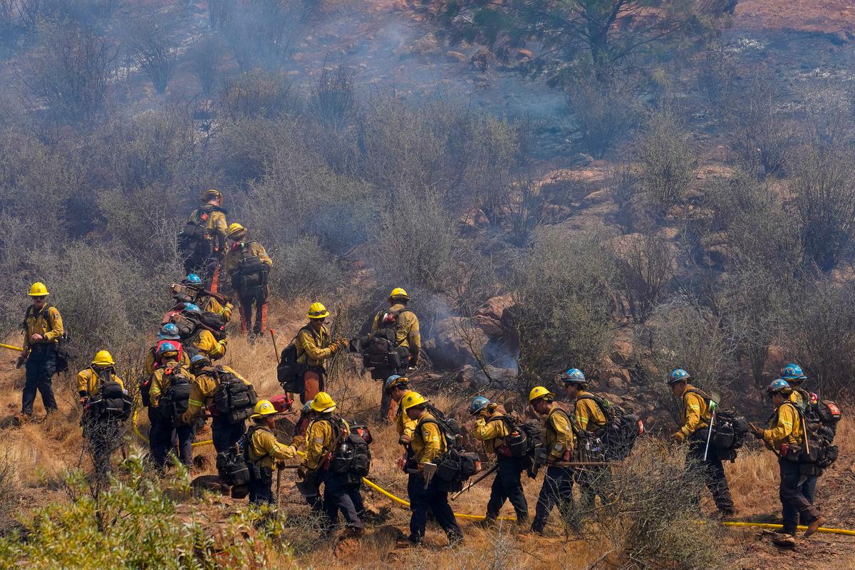 California Department of Forestry and Fire Protection (Cal Fire) firefighters work along Six Bit Ranch Rd. near Chinese Camp, Tuolumne County, California, U.S., September 3, 2025. REUTERS/Tracy Barbutes
