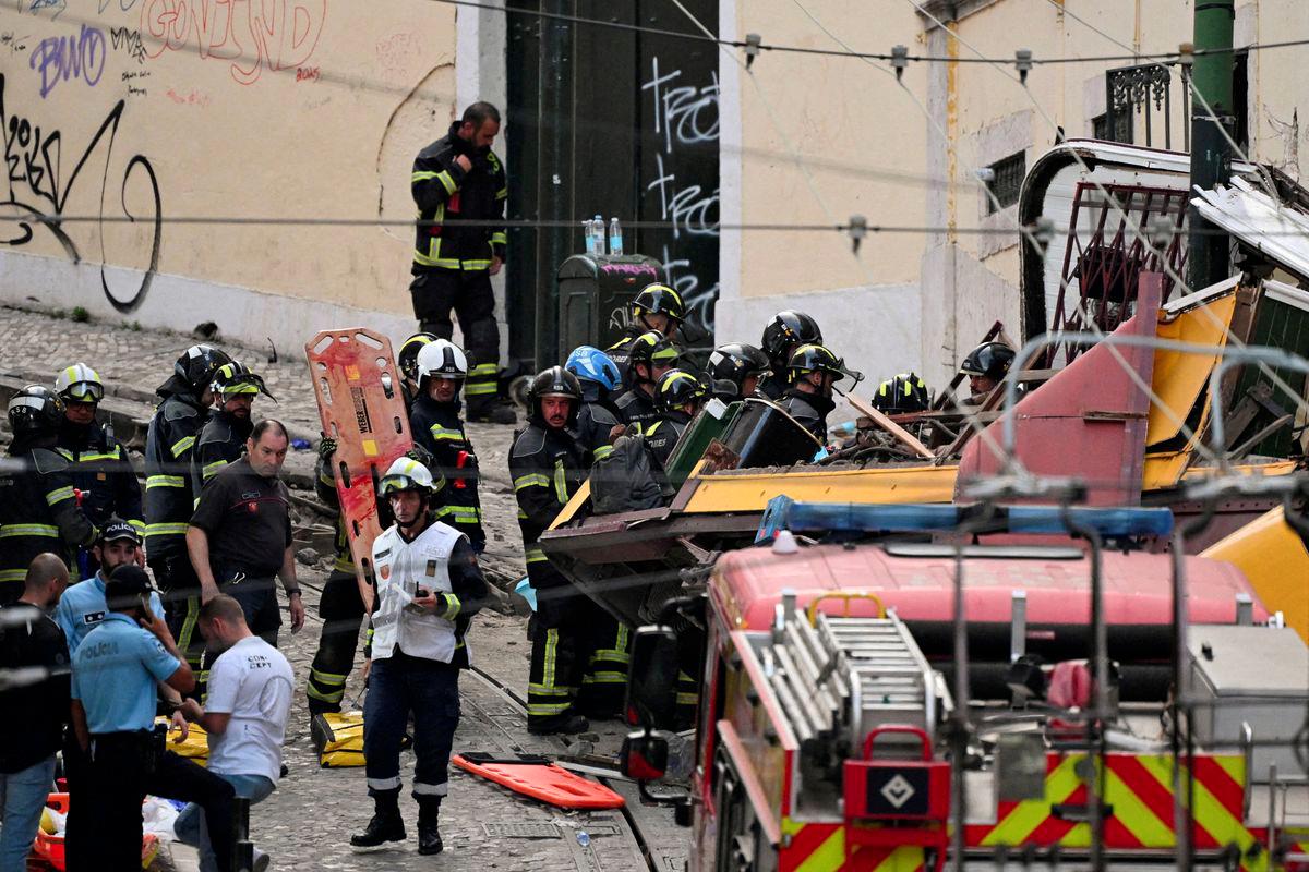 First responders work at the site of an accident involving Lisbon's Gloria funicular, a popular tourist attraction, which derailed and crashed, resulting in fatalities and injuries, according to authorities, in Lisbon, Portugal, September 3, 2025. - REUTERSPIX
