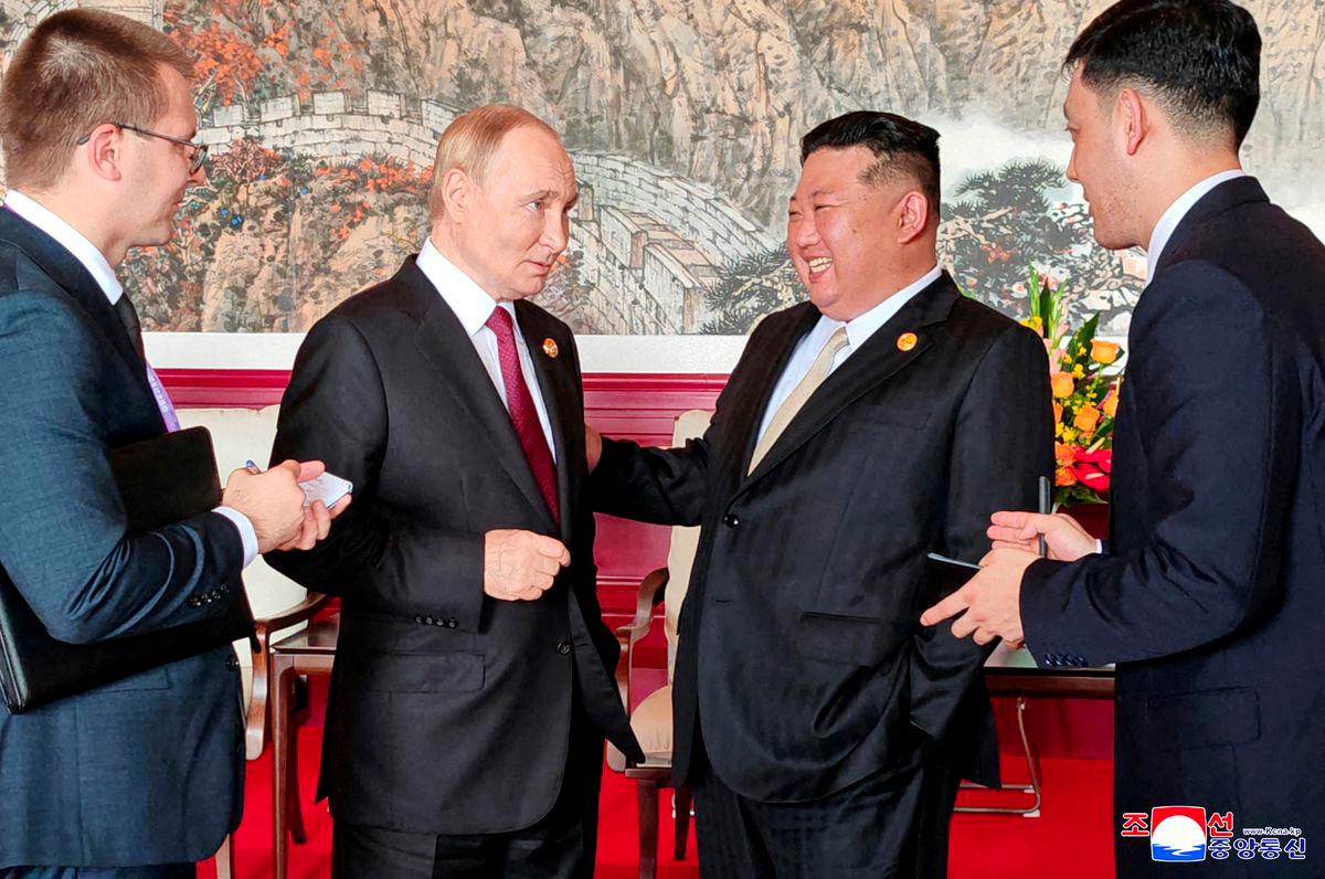 North Korean leader Kim Jong Un speaks with Russian President Vladimir Putin during their visit to Beijing to attend China's commemoration of the 80th anniversary of the end of World War Two, in Beijing, China, September 3, 2025, in this picture released by the Korean Central News Agency. - KCNA via REUTERSPIX