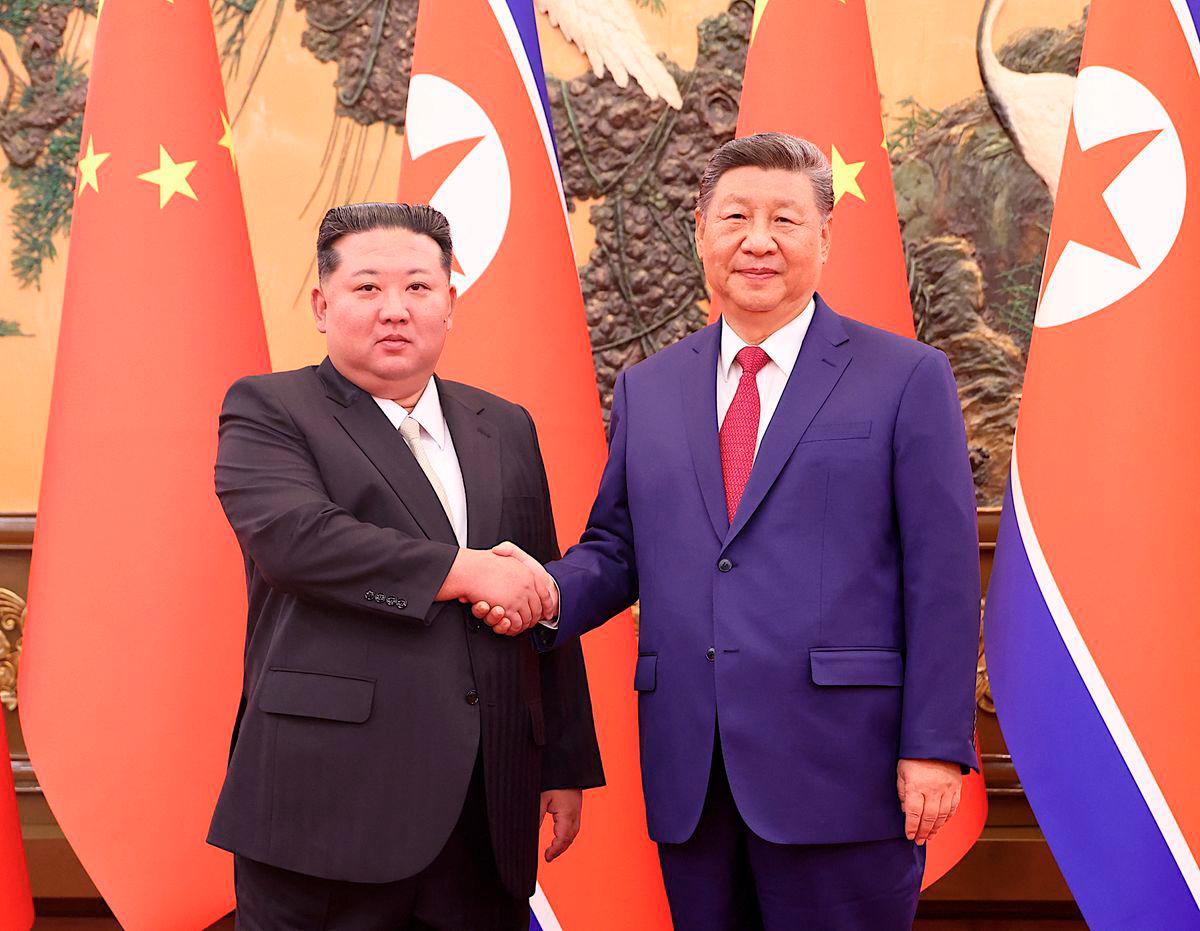 Chinese President Xi Jinping and Democratic People's Republic of Korea (DPRK) leader Kim Jong Un shake hands at the Great Hall of the People in Beijing, China September 4, 2025. - China Daily via REUTERS