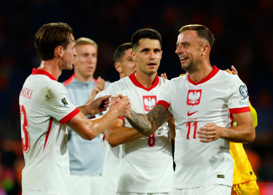Poland’s Kamil Grosicki, Poland’s Bartosz Kapustka and Poland’s Jakub Kaminski react after the match REUTERSPix