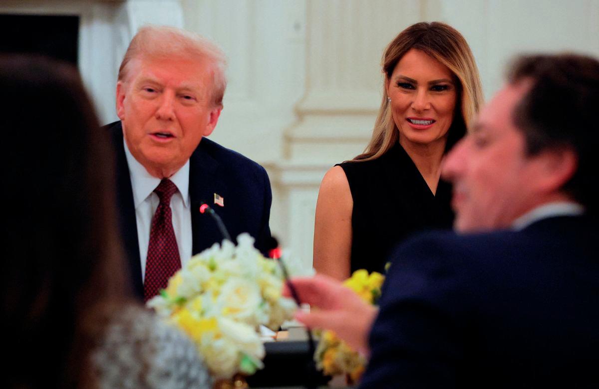 U.S. President Donald Trump and first lady Melania Trump attend a private dinner for technology and business leaders in the State Dining Room at the White House in Washington, D.C., U.S., September 4, 2025. REUTERS/Brian Snyder