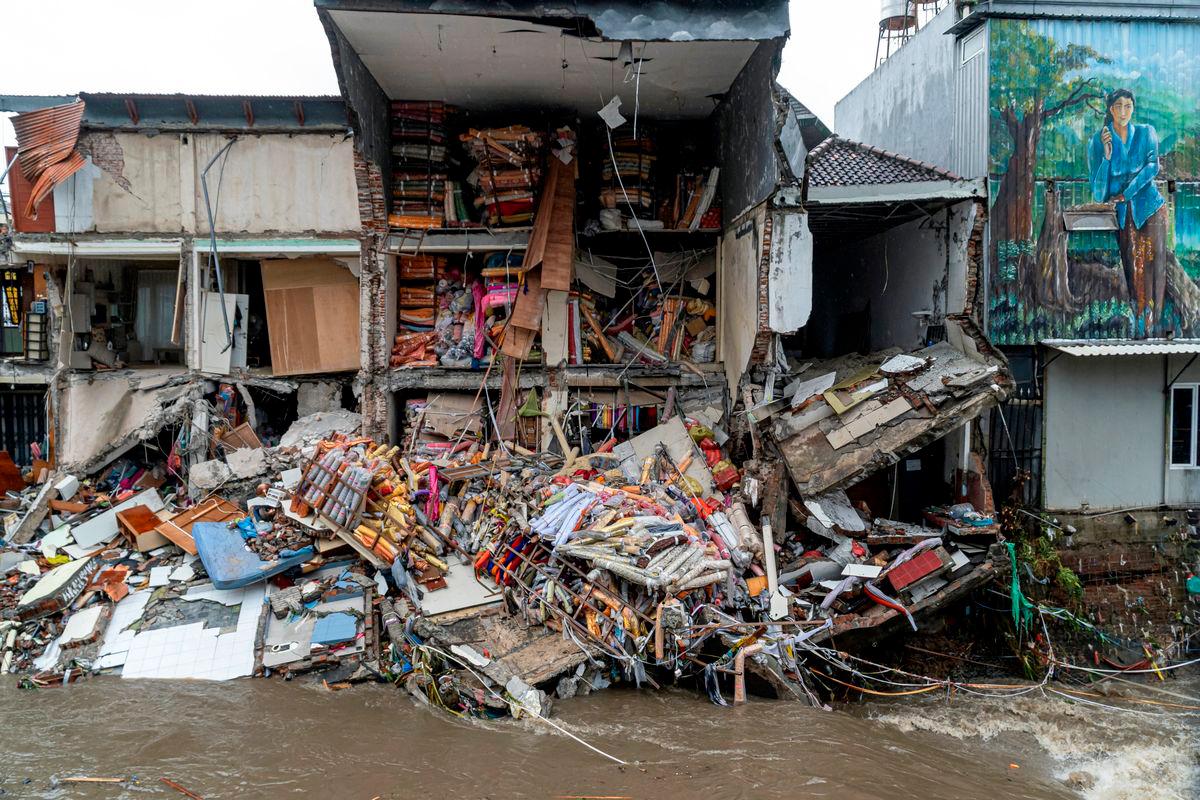Goods lie scattered at a fabric store that collapsed after being hit by floods following overnight heavy rains in Denpasar, Bali, Indonesia September 10, 2025. REUTERS/Dicky Bisinglasi