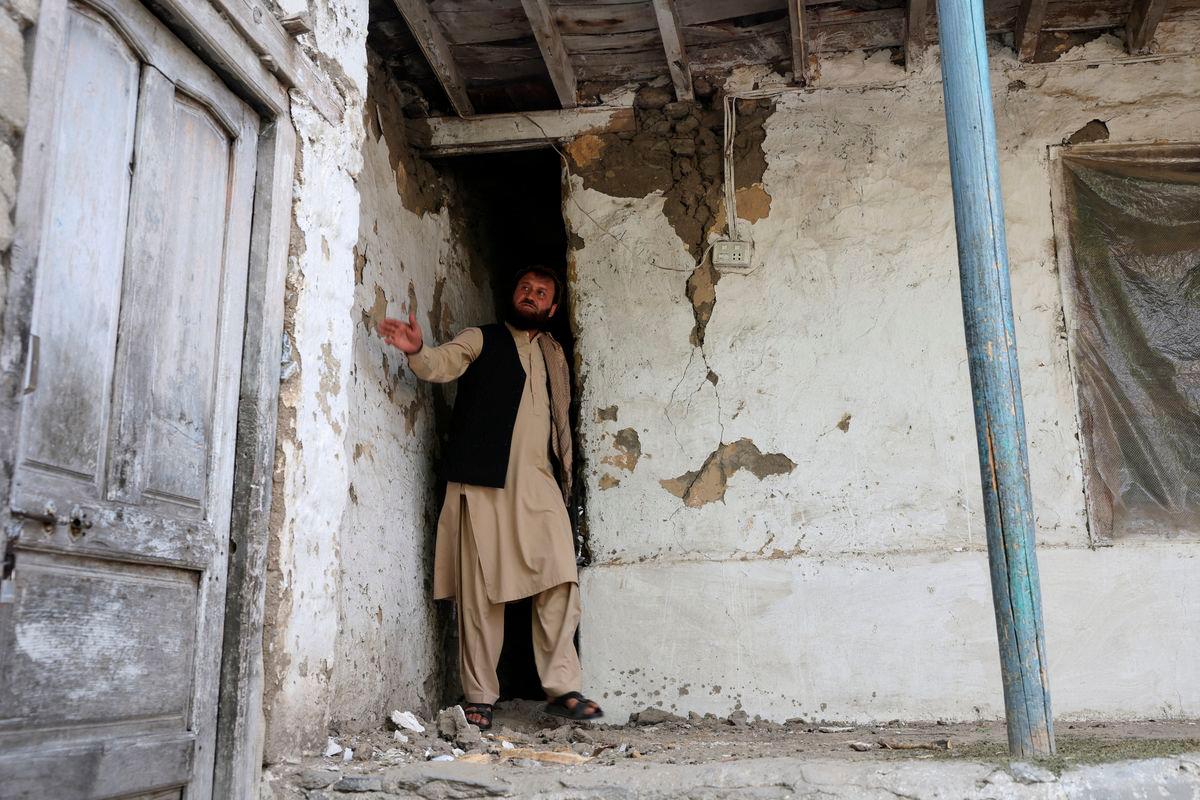 Jabar Khan, 43, looks at damage at the house of his neighbour, following a deadly earthquake in Bambakot village in Dera Noor district in Nangarhar province, Afghanistan September 6, 2025. REUTERS/Sayed Hassib