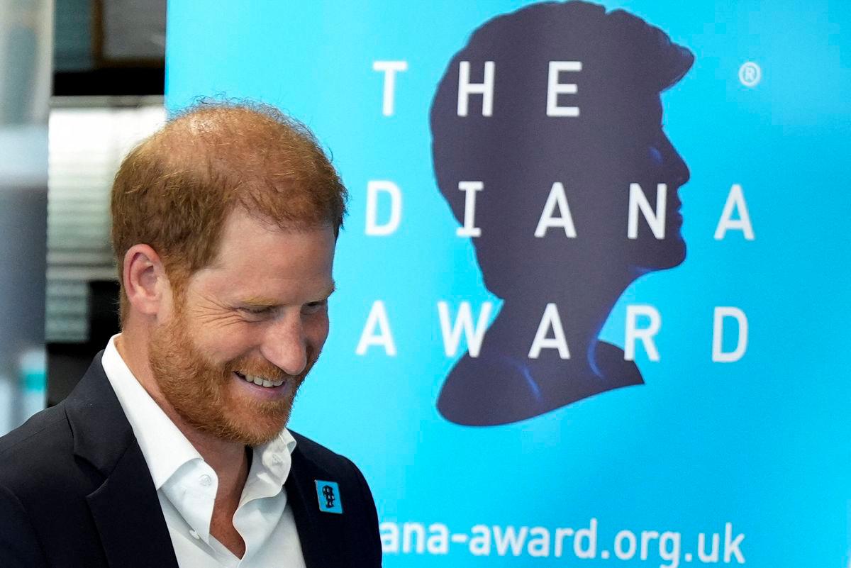 Britain’s Prince Harry, Duke of Sussex, reacts as he arrives to take part in a panel discussion on how social action positively impacts mental health, with four young people who are involved with The Diana Award, in central London on September 11, 2025. (Photo by Aaron Chown / POOL / AFP)