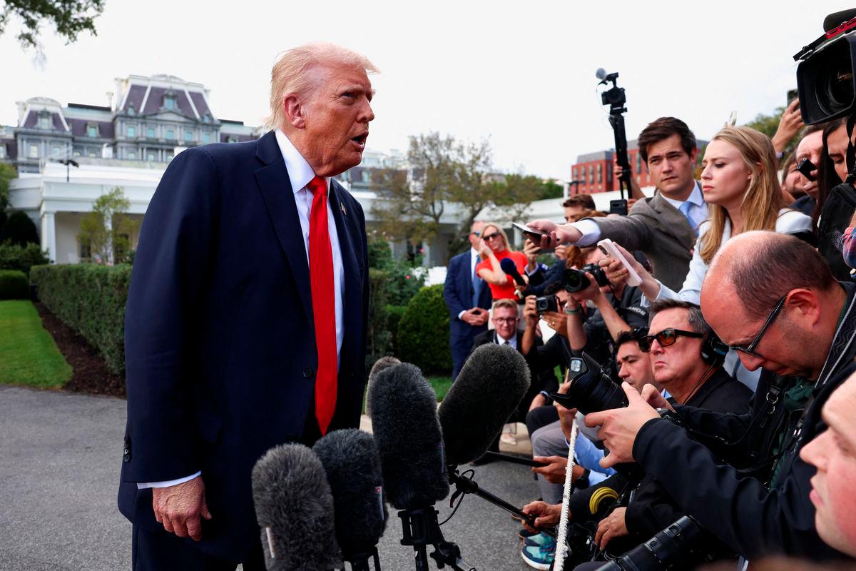 U.S. President Donald Trump speaks to the media before boarding Marine One upon departure for New York, in Washington, D.C., U.S., September 11, 2025. REUTERS/Evelyn Hockstein