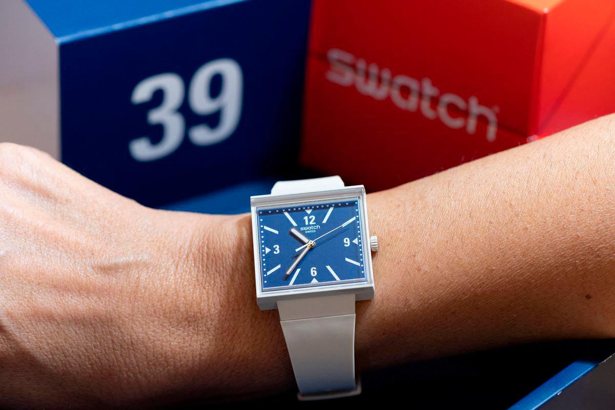 A model from Swiss watchmaker Swatch named “WHAT IF...TARIFFS?” with the numbers 3 and 9 reversed on its face, as a play on the 39% import tariffs that U.S. President Donald Trump slapped on Switzerland last month, is pictured on wrist at a Swatch shop in Geneva, Switzerland, September 12, 2025. REUTERS/Pierre Albouy