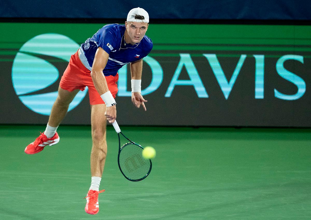 Jakub Mensik of Czechia serves the ball against Taylor Fritz of the United States in the second rubber of the Davis Cup tie between the USA and Czechia at Delray Beach Tennis Center. - Mullane-Imagn Images