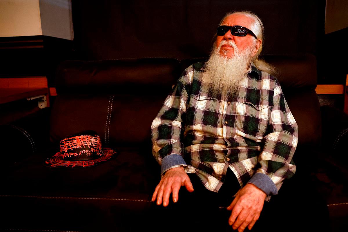 FILE PHOTO: Jazz musician Hermeto Pascoal sits before performing on stage at the Sugar Club, in Dublin, Ireland July 12, 2023. REUTERS/Clodagh Kilcoyne/File Photo