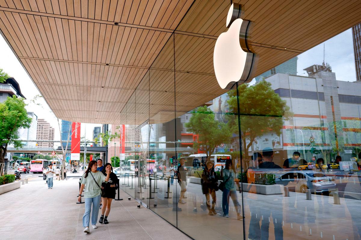 For representational purposes only: People walk pass an Apple Store in Taipei, Taiwan, September 19, 2025. REUTERS/Ann Wang