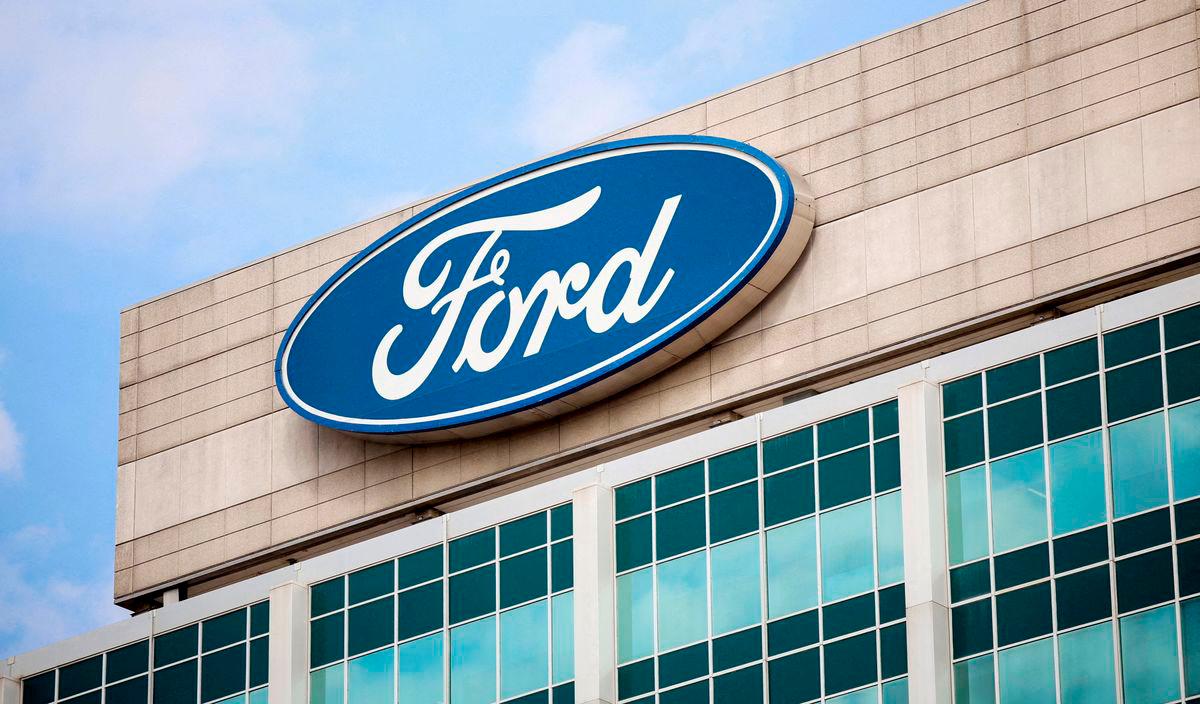 FILE PHOTO: A Ford logo is seen on the Ford Motor World headquarters in Dearborn, Michigan, U.S., March 12, 2025. REUTERS/Rebecca Cook/File Photo/File Photo