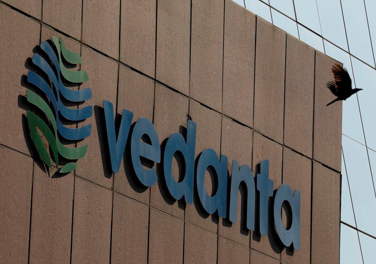 FILE PHOTO: A bird flies past the logo of Vedanta installed on the facade of its headquarters in Mumbai, India January 31, 2018. REUTERS/Danish Siddiqui/File Photo