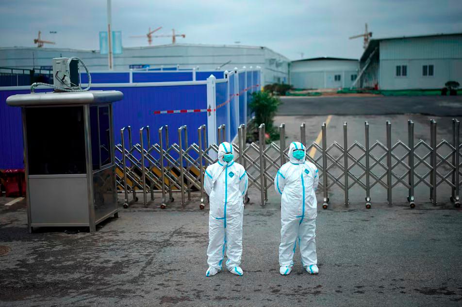 Workers in protective suits are seen at the Leishenshan Hospital, a makeshift hospital for treating patients with the coronavirus disease (COVID-19), in Wuhan, Hubei province, China April 11, 2020. - REUTERS