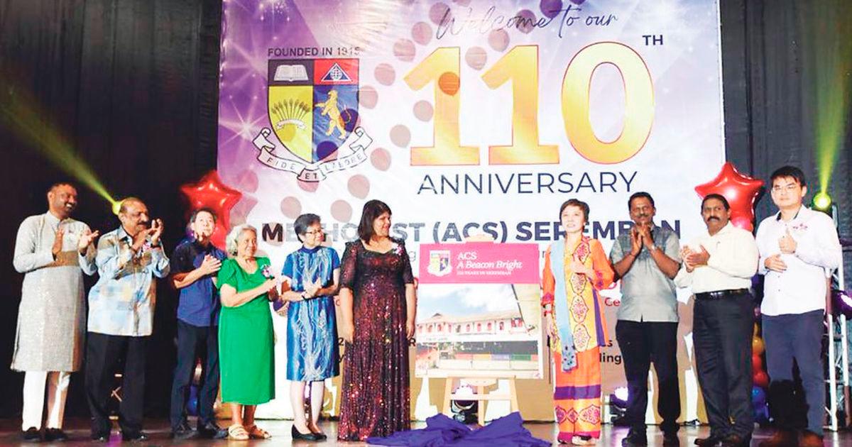 Tan (4th right) launches the book while Indrani (5th right), Rebecca (4th left), Ron (left) and other special guests look on.