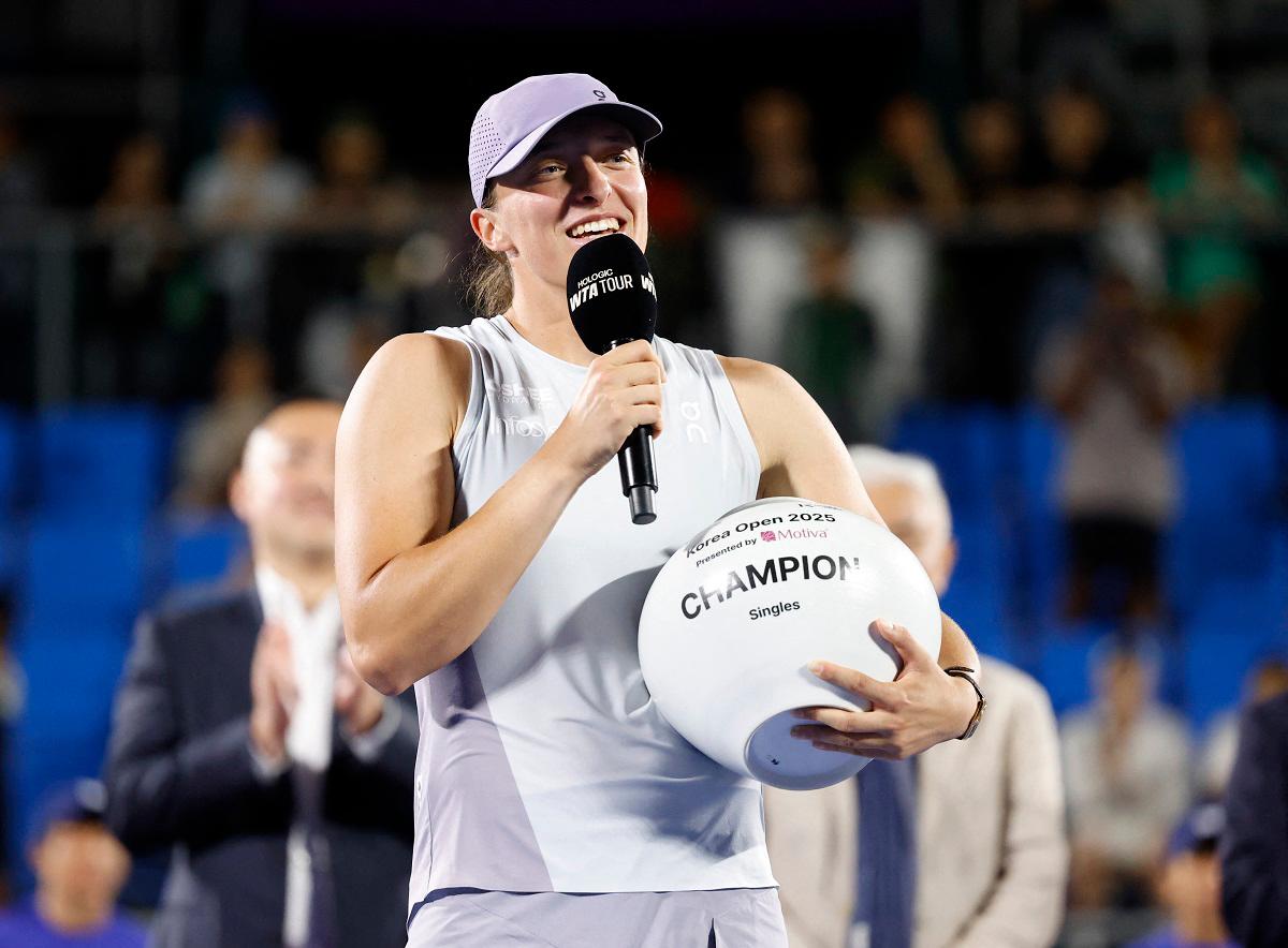 Poland’s Iga Swiatek celebrates with the trophy after winning her singles final against Russia’s Ekaterina Alexandrova. - REUTERS/Kim Soo-Hyeon