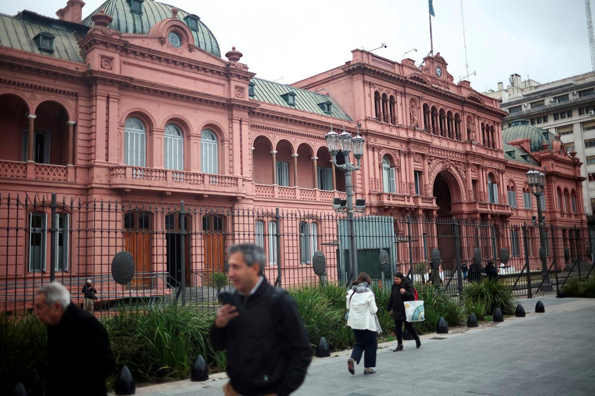 People walk past Casa Rosada Presidential Palace a day after big defeat for Argentina's President Javier Milei in the legislative elections in the province of Buenos Aires, in Buenos Aires, Argentina September 8, 2025. - REUTERSPIX