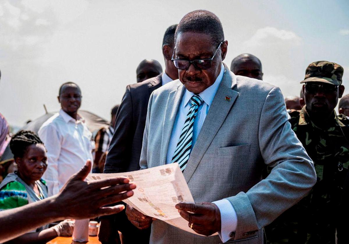 Malawi’s presidential candidate and leader of the Democratic Progressive Party Peter Mutharika inspects a ballot paper before casting his vote during the general election at Thyolo District, south of Blantyre, Malawi, September 16, 2025. - REUTERSPIX