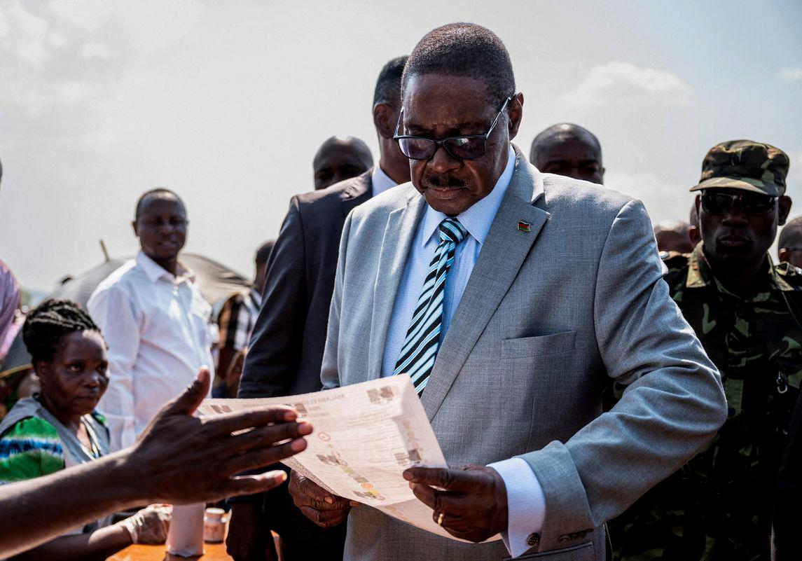 Malawi's presidential candidate and leader of the Democratic Progressive Party Peter Mutharika inspects a ballot paper before casting his vote during the general election at Thyolo District, south of Blantyre, Malawi, September 16, 2025. - REUTERSPIX