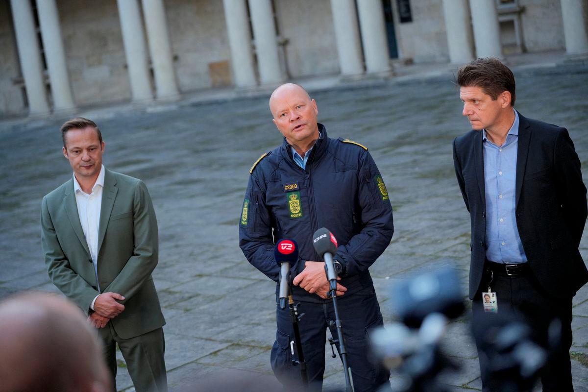 Police Inspector Jens Jespersen speaks to the media next to COO of Naviair Morten Fruensgaard and Chief Operating Officer (COO) of Copenhagen Airports Kristoffer Plenge-Brandt during a press conference at the police headquarters in Copenhagen, Denmark September 23, 2025. - Ritzau Scanpix/Emil Helms via REUTERSPIX