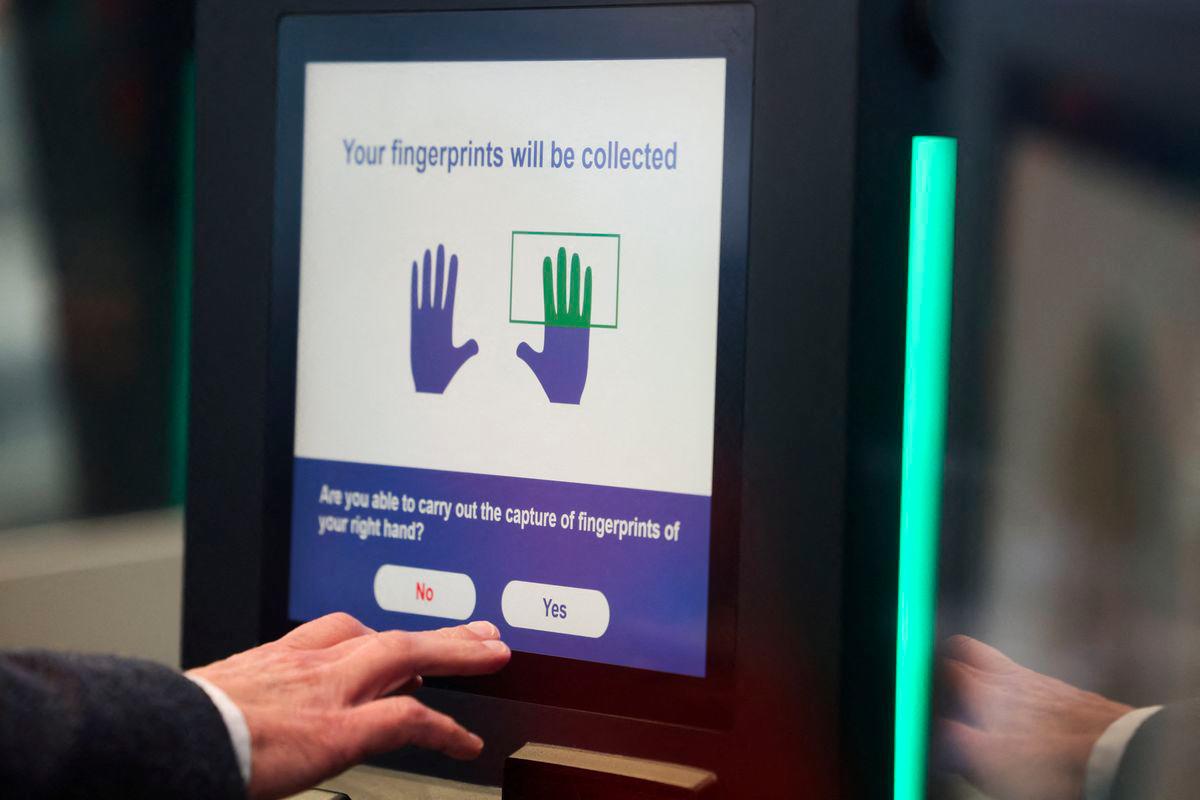 A man operates an automated EES kiosk during a demonstration of the European Union's Entry/Exit System (EES) at the Eurotunnel terminal in Folkestone, Britain, September 23, 2025. - REUTERSPIX