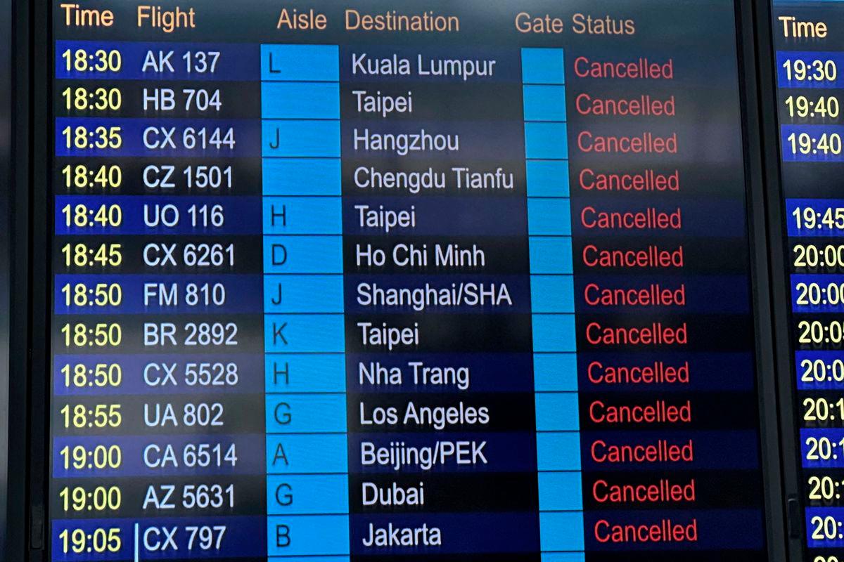 A departure board displays flight cancellations at Hong Kong International Airport, as Super Typhoon Ragasa disrupts travel, in Hong Kong, China, September 23, 2025. - REUTERSPIX