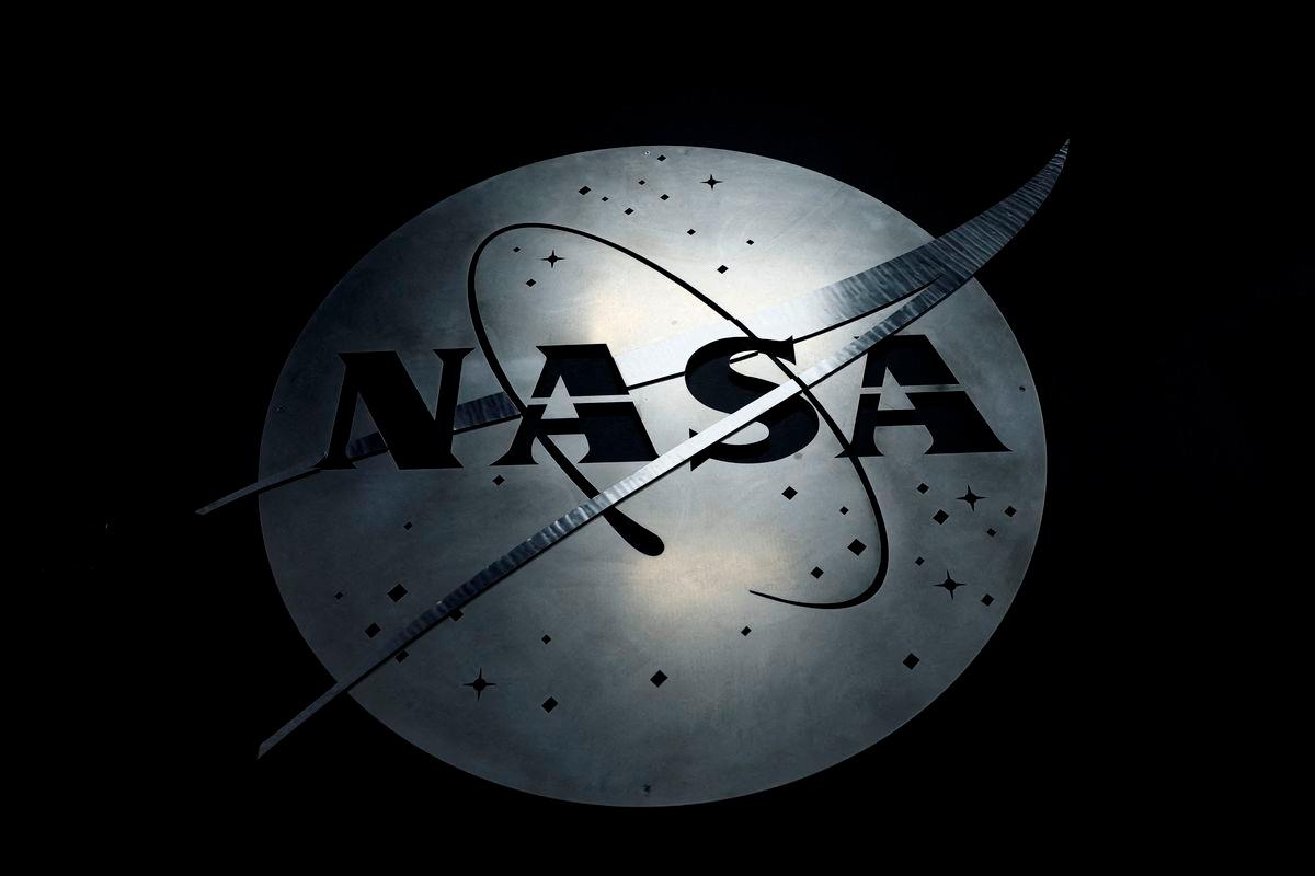 FILE PHOTO: The NASA logo hangs in the Mission Operations Control Center at Wallops Flight Facility on Wallops Island, Virginia, U.S., October 26, 2022. REUTERS/Evelyn Hockstein/File Photo
