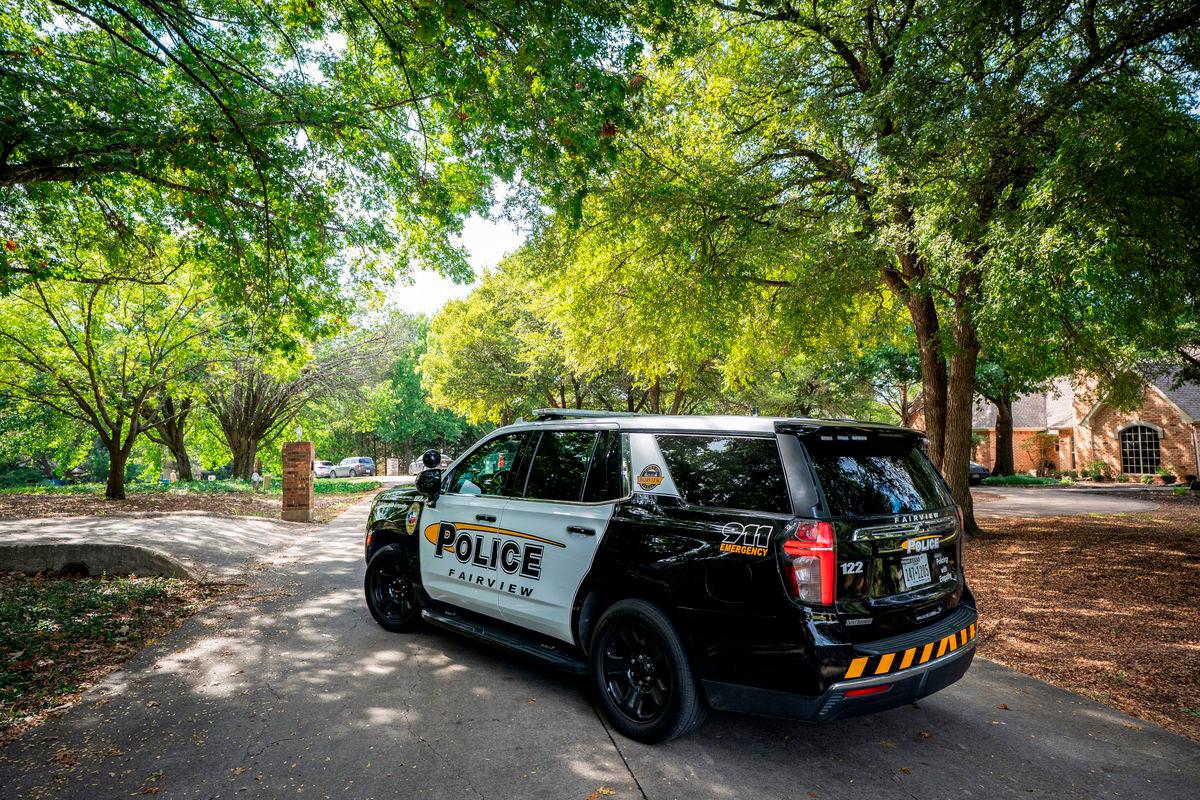A Fairview Police Department vehicle blocks the suburban street where Joshua Jahn, the suspected gunman in a fatal shooting at a Dallas Immigration and Customs Enforcement (ICE) field office lived, in Fairview, Texas, U.S., September 24, 2025. REUTERS/Jeffrey McWhorter