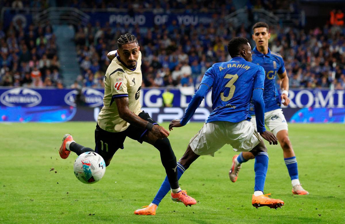 FC Barcelona’s Raphinha in action with Real Oviedo’s Rahim Alhassane REUTERS