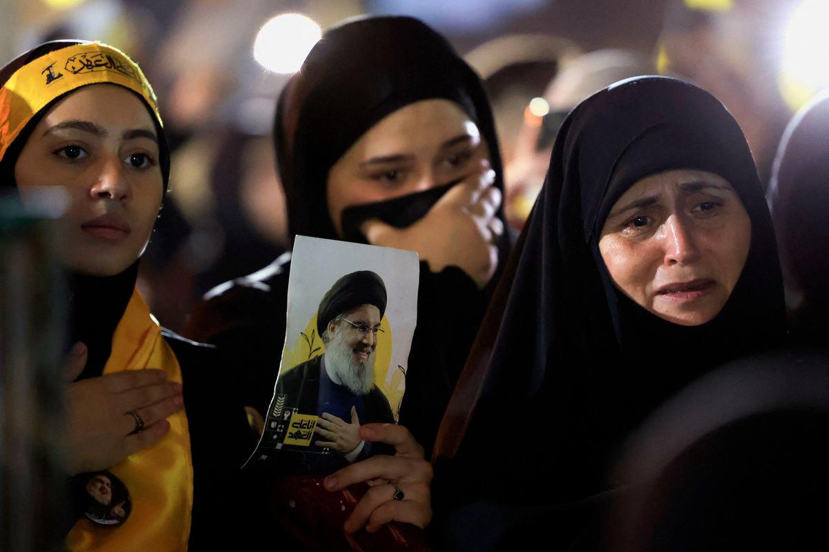 Hezbollah supporters react as they gather at the site where the group's late leader Hassan Nasrallah was killed, before the first anniversary of his assassination in an airstrike, in Beirut's southern suburbs, Lebanon, September 26, 2025. - REUTERSPIX