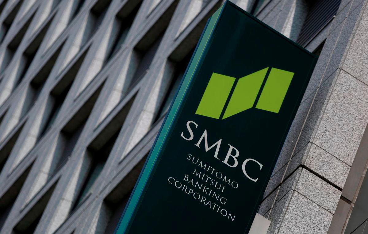 A sign board of Sumitomo Mitsui Banking Corporation is seen outside its branch in Tokyo July 30, 2014. - REUTERS